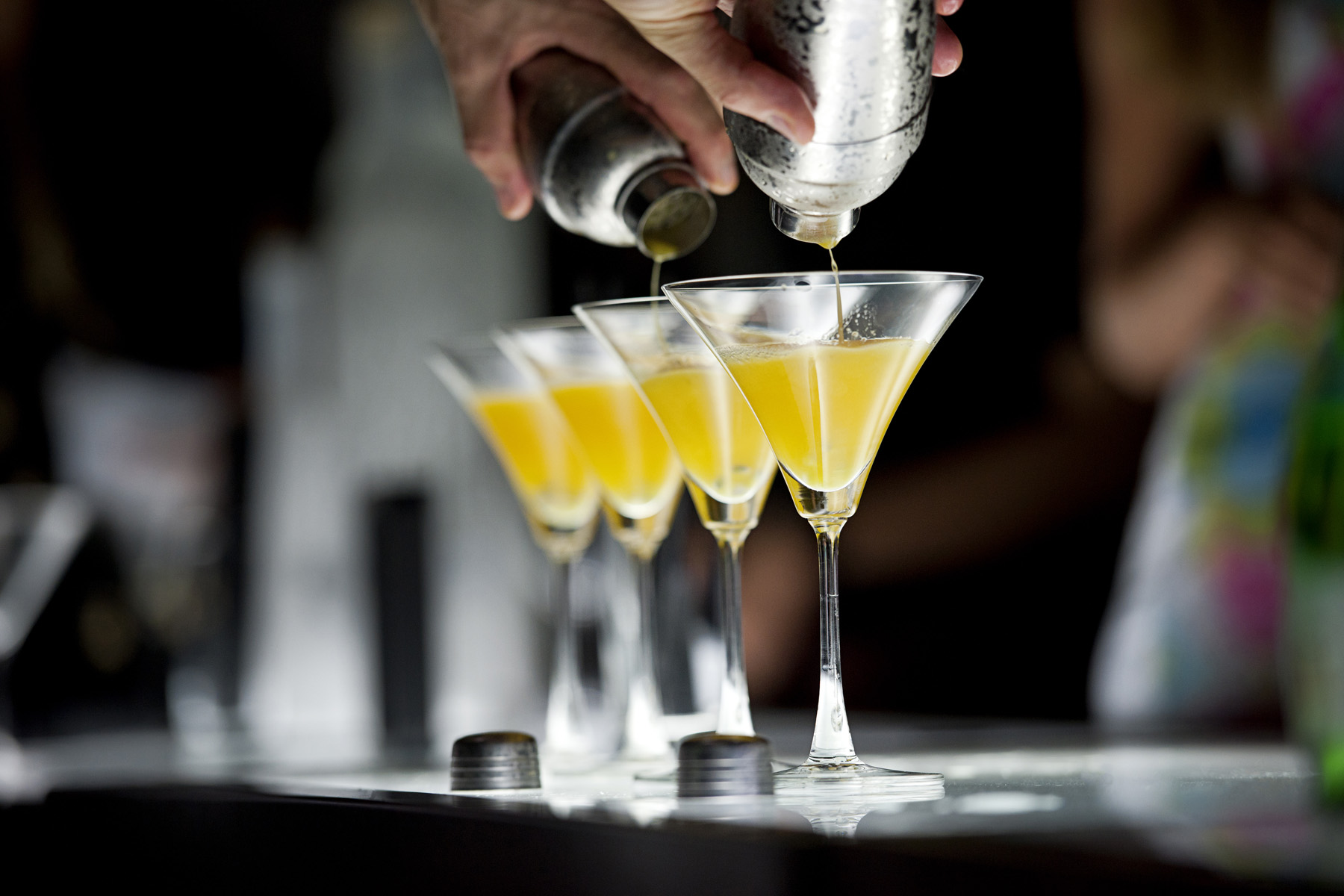 Hospitality — cocktails being poured at a bar